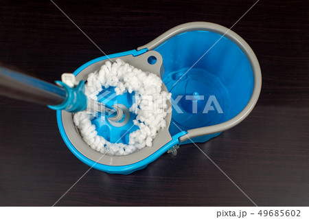 Floor cleaning with mob and bucket on background. 49685602