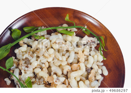Fresh Red ant eggs are larvae of ants in wood dish Fresh Red ant eggs are larvae of ants in wood dish 49686297