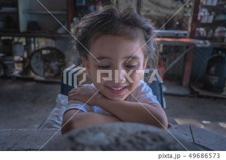 a boy wear black tee shirt watching his mobile 49686573