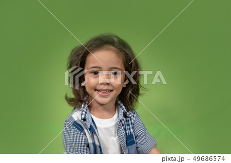 a cute long hair boy smiling 49686574