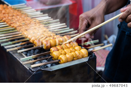 japanese meatball grill  or tsukune. 49687043