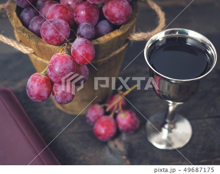 Man breaking the bread, with wine, grapes and Man breaking the bread, with wine, grapes and 49687175