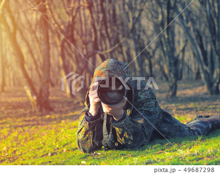 Wildlife, nature man photographer in camouflage 49687298