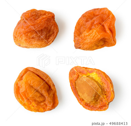 Set of dried apricots with stone on a white. The 49688413