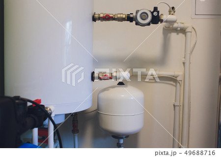 Hot water boiler. Boiler room with a heating system. Hot water boiler. Boiler room with a heating system. 49688716