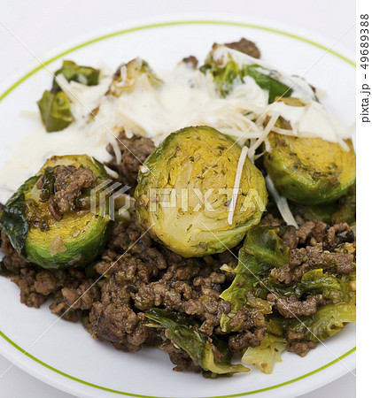 Brussels sprouts and beef on white background 49689388