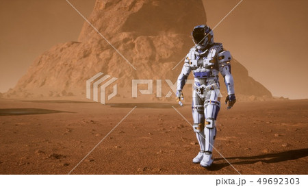 Astronaut goes on the surface of Mars through a dust storm past the giant solar panels. Panoramic 49692303
