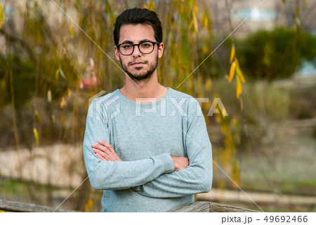 Young student of computer science poses at the campus park near the Polytechnic School 49692466