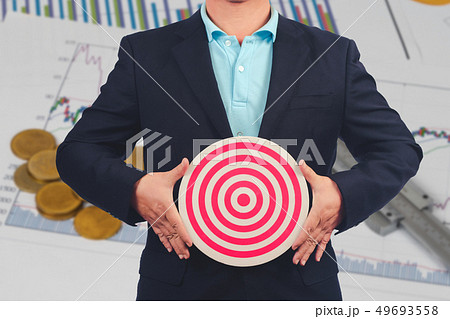 Business Man holding dart board ,Business target 49693558