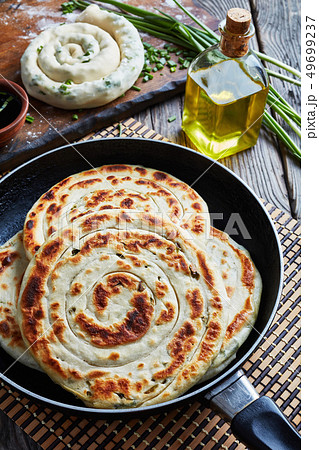 hot Chinese scallion Pancakes in a skillet hot Chinese scallion Pancakes in a skillet 49699237