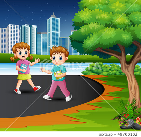 Happy school children are walking on the road 49700102