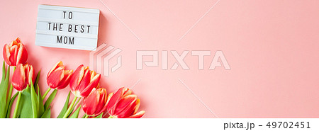 Mothers Day greeting card with red tulip flowers Mothers Day greeting card with red tulip flowers 49702451