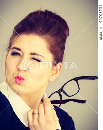 Coquet business woman flirting at work Coquet business woman flirting at work 49703535