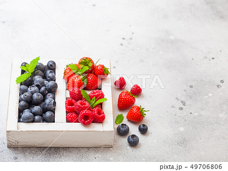 Fresh raw organic berries in white vintage wooden 49706806