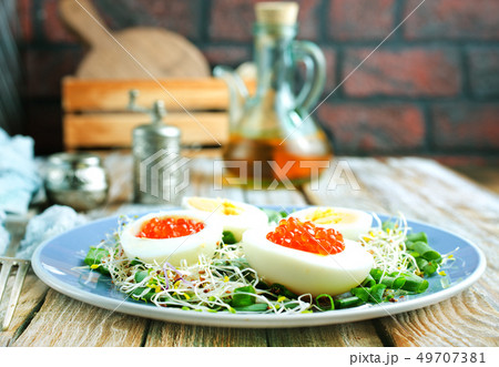 eggs with red salmon caviar 49707381