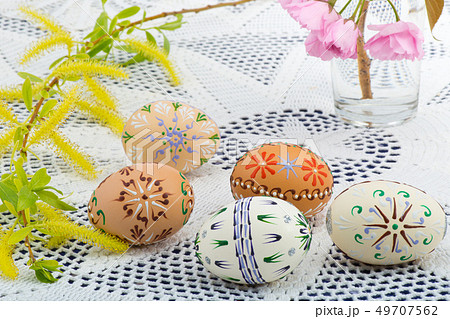 Painted Easter eggs with a blossom on the desk 49707562