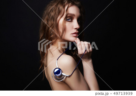 beautiful girl with necklace on her naked back beautiful girl with necklace on her naked back 49713939