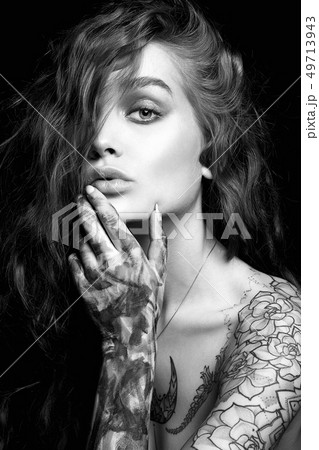 Sexy Girl with Tattoo and color paint on her Body. 49713943