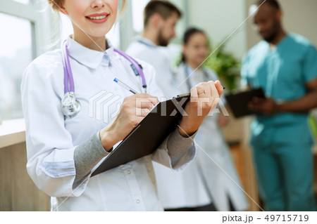 Healthcare people group. Professional doctors working in hospital office or clinic Healthcare people group. Professional doctors working in hospital office or clinic 49715719