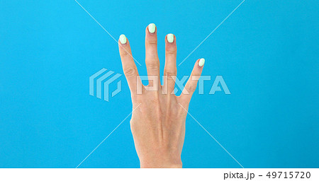 Closeup female hand counting from 0 to 5 Closeup female hand counting from 0 to 5 49715720