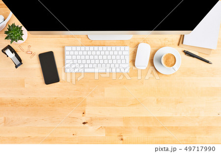 Top view of large desktop computer on wooden table Top view of large desktop computer on wooden table 49717990
