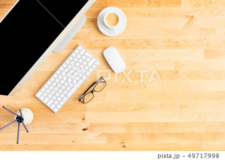 Top view of large desktop computer on wooden table Top view of large desktop computer on wooden table 49717998