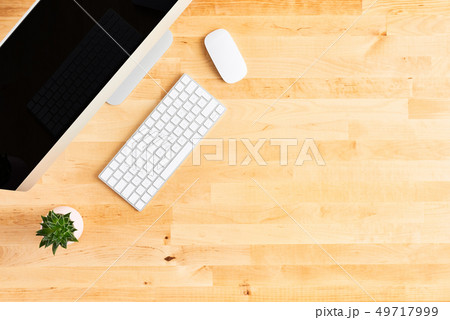Top view of large desktop computer on wooden table 49717999