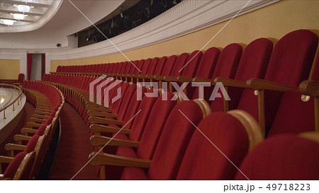 The interior of the theater arts. The auditorium with seats and balcony. Soft focus. Seats in the 49718223