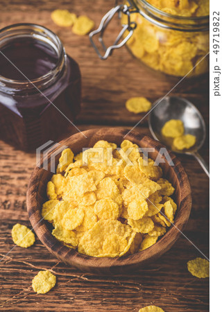 Breakfast with corn flakes, milk and jam 49719822