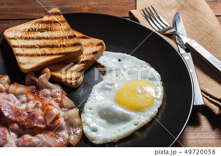 Fried egg and bacon 49720058