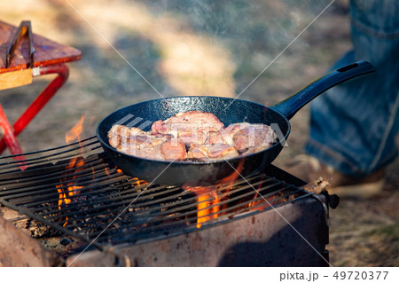 Cooking tasty meat barbecue open fire close up Cooking tasty meat barbecue open fire close up 49720377