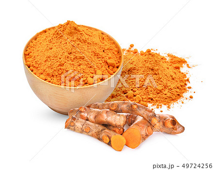 turmeric root and turmeric powder in wooden bowl turmeric root and turmeric powder in wooden bowl 49724256