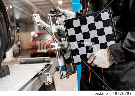 collapse-convergence. auto mechanic sets the car for diagnostics and configuration. Car Wheels 49726793