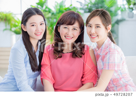 two daughter with mother smile two daughter with mother smile 49728207