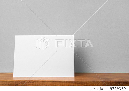 front view of greeting card on bookshelf and grey front view of greeting card on bookshelf and grey 49729329