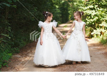 happy beautiful girls with white wedding dresses 49731649