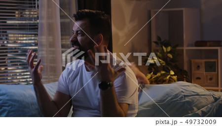 Couple having late night argument 49732009