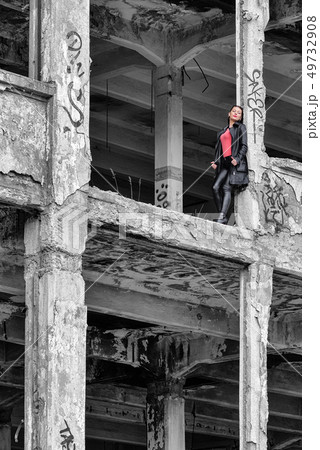 Pretty girl in ruined building Pretty girl in ruined building 49732908