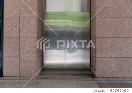 sidewalk by street wall & door sidewalk by street wall & door 49745100