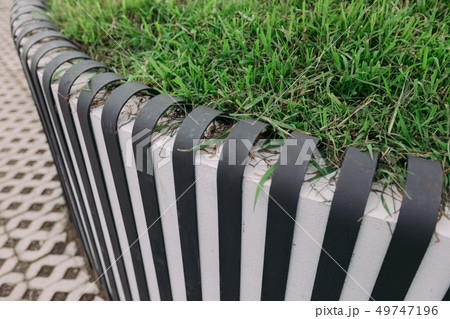 Matellic fence near the lawn 49747196