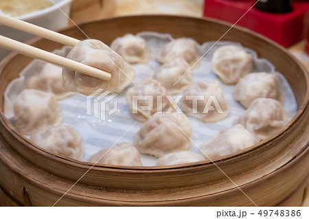 Xiao long bao soup dumpling buns with chopsticks 49748386