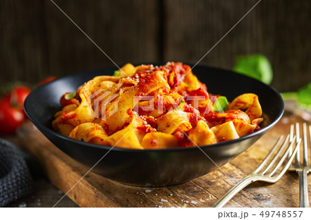 Tasty italian pizza with tomato sauce and parmesan 49748557