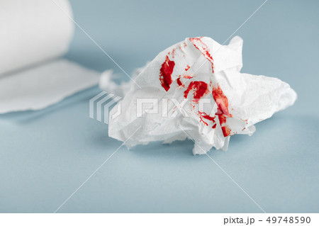 Hemorrhoids, treatment health problems. Toilet paper with the blood drops 49748590