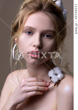 Tender young blonde-haired young woman with nice hairstyle Tender young blonde-haired young woman with nice hairstyle 49749257