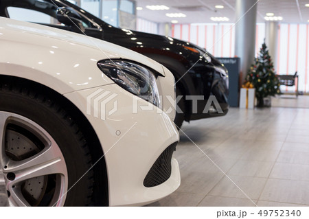 New cars at dealer showroom. Car auto dealership. 49752340