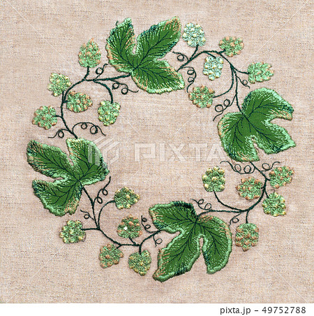 Frame of embroidery green leaves and flowers Frame of embroidery green leaves and flowers 49752788