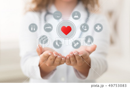 Doctor holding modern virtual screen interface with icons Doctor holding modern virtual screen interface with icons 49753083