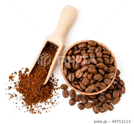 Coffee beans and instant coffee in wooden utensils Coffee beans and instant coffee in wooden utensils 49753113