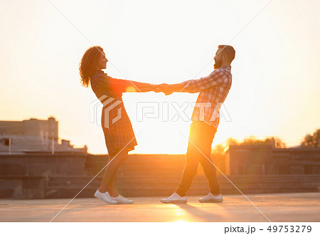 Cute couple spending time and dancing in the city 49753279