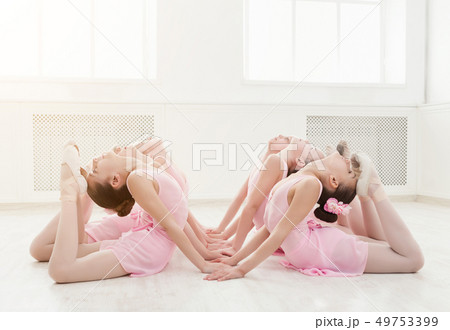 Little girls dancing ballet in studio 49753399